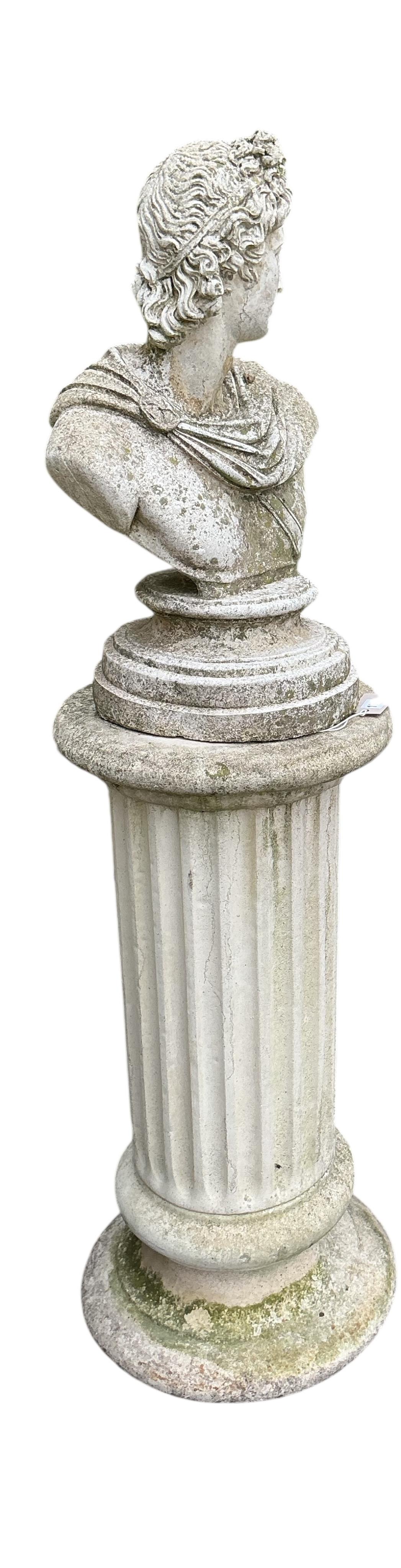 A reconstituted stone Roman style bust on fluted pillar, height 130cm